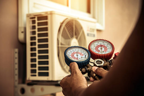 Professional Air Conditioning Service technician working in Wilder, KY